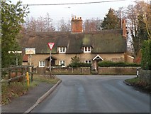 TL8270 : Thatched cottages in West Stow village by Robert Edwards