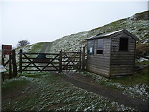SN6619 : Ticket collector's hut at Carreg Cennen Castle in winter by Jeremy Bolwell