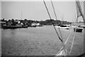 Boats and a steam vessel on river