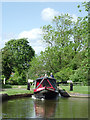 Narrowboat leaving Filance Lock at Penkridge, Staffordshire