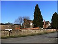 Signpost and wall at High Holbeck