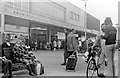 Shoppers outside Boots and J. Sainsbury