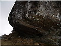 NN2274 : Rock undercut above Allt na Coire Eoin in Killiechonate Forest by ian shiell