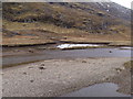 NN2274 : Remains of sheet ice on Allt Coire an Eoin in Killiechonate Forest by ian shiell