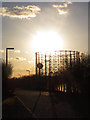 Gasholder against the sun