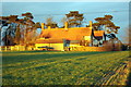 Severalls Cottages bathed in setting sunlight