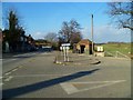 Bus shelter and telephone kiosk at the road junction at Offham