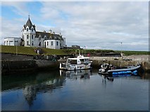 ND3773 : John O'Groats harbour and a derelict hotel. by Robin Drayton