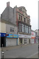 Stone lions at the top of 21 Oxford Street, Swansea