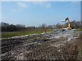 Piles of lime and excavator