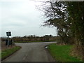 Junction of road from Matching Hall with Downhall Road