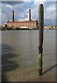 Pole and power station, River Thames