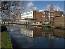 TQ2083 : Industrial building by the Grand Union Canal by Derek Harper