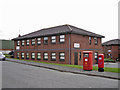 Post boxes and office building, West Heath