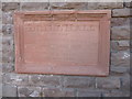 Stone plaque on the old Drill Hall, Baker Street, Abergavenny