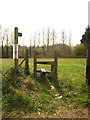 Footpath sign and stile