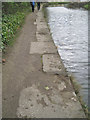SK3687 : Unequal stone blocks edge the canal by Robin Stott