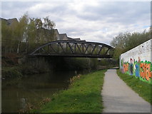 SE2420 : Disused railway bridge over the canal at Savile Town by John Slater