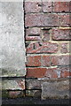 Benchmark on garage at rear of Burlington Road house