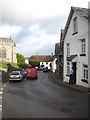 The postman doing his rounds in Fore Street South Tawton