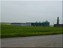 TF2103 : Farm buildings and silos, Green Road near Eye by Richard Humphrey