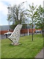 A piece of public art on green land at the junction of Blacks Road and Andersonstown Road