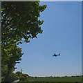 A light aircraft landing at Barton Aerodrome