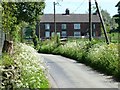 Four terraced houses alongside the road to Winkhill