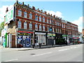 TQ2485 : A block of shops at the southern end of  Cricklewood Broadway London NW2 by Jaggery