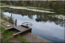 NU2517 : Sluice at the outflow from the lake at Howick Hall Gardens by Phil Champion
