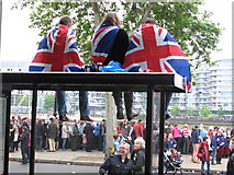 TQ2777 : Diamond Jubilee Pageant - flag-draped lads up on a bus stop by David Hawgood