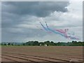 Red Arrows on a low-level run towards the airfield