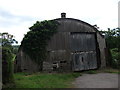 Curved steel farm building