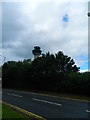 Radio Control Tower Looming over Trees