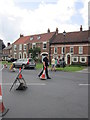 Armed policeman on cone duty