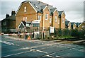 Level crossing and entrance to North Sheen station