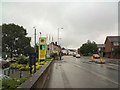 SJ9595 : A wet Monday outside Morrisons on Mottram Road by Gerald England