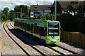 TQ2768 : Tram Approaching the Mitcham Tram Stop by Peter Trimming