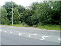 Boulders block vehicular access to a track  at the edge of Usk Road near Little Mill