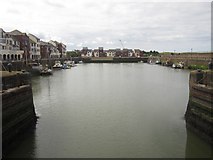 NY0336 : Looking south into the harbour from the footbridge, Maryport by Graham Robson