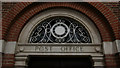 Clock face within decorative fanlight, Dorking Post Office