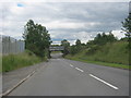 The A4109 heading to pass under a railway bridge at Dyffryn Cellwen