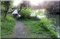 Footbridge over fishing lake at sunset