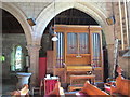 NY8773 : St. Mungo's Church, Simonburn - organ and Georgian font by Mike Quinn