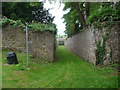 Walled pathway through Tidenham Manor gardens