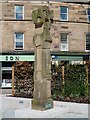 Man with a sheep statue in the Market Square, Galashiels