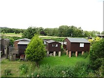TL1697 : Holiday chalets on the south bank of the Nene by Christine Johnstone
