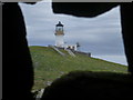 NA7246 : Flannan Isles: the lighthouse through a hole in the wall by Chris Downer