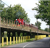 TQ9064 : Train crossing viaduct by David Kemp