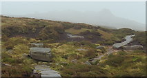 SK0886 : Moorland path and rocky outcrops in the mist by Andrew Hill
